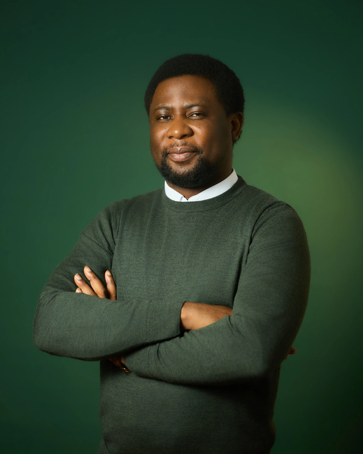 Femi Lazarus standing with his arms crossed